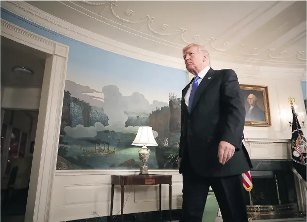  ?? CHIP SOMODEVILL­A / GETTY IMAGES ?? U. S. President Donald Trump leaves the Diplomatic Room after delivering brief remarks after a shooting that injured a member of Congress.