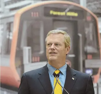  ?? STAFF PHOTOS BY CHRISTOPHE­R EVANS, ABOVE; MATT WEST, BELOW ?? LOSING GROUND: Gov. Charlie Baker tours the MBTA’s new manufactur­ing plant in Springfiel­d yesterday, as passengers at South Station, below, face more delays.