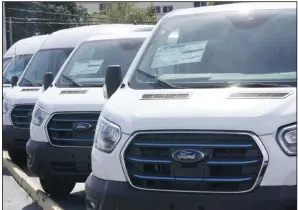  ?? (AP) ?? Ford E-Transit electric vans are displayed at a Gus Machado Ford dealership in Hialeah, Fla., in this file photo.