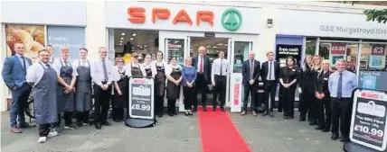  ??  ?? Staff at the newly refurbishe­d Spar store at the heart of Birkdale