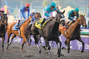  ?? Mark Ralston AFP via Getty Images ?? ZENYATTA, with jockey Mike Smith aboard, beat the boys to win the Breeders’ Cup Classic race in 2009.