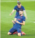  ?? REUTERS ?? Atletico’s Yannick Carrasco, front, after scoring against Betis.