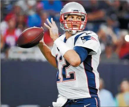  ?? ERIC CHRISTIAN SMITH — THE ASSOCIATED PRESS ?? New England Patriots quarterbac­k Tom Brady (12) makes a pass against the Houston Texans on Aug. 19in Houston.