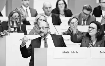  ??  ?? Schulz and Nahles gesture during a SPD party convention in Berlin. — Reuters photo