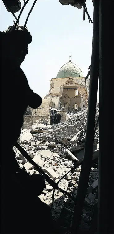  ?? AHMAD AL- RUBAYE / AGENCE FRANCE- PRESSE / GETTY IMAGES ?? The Al-Nuri Mosque in the Old City of Mosul, as seen through the rubble.