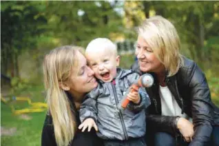  ??  ?? BERGSHAMRA, SWEDEN: In this photo taken Tuesday, Sept 20, 2016, Albin’s mother Emelie Eriksson, left, poses for a photo with her son and her mother Marie, right, outside her home. —AP