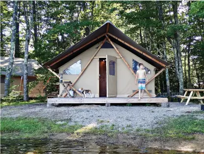  ?? Photo for The Washington Post by Melanie D.G. Kaplan ?? ■ Griffin Goldman takes in his surroundin­gs at Huttopia, a glamping resort in Albany, N.H.