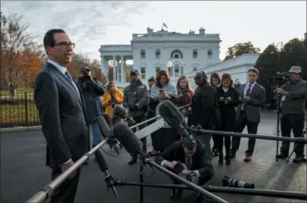  ?? EVAN VUCCI — THE ASSOCIATED PRESS ?? Treasury Secretary Steve Mnuchin talks with reporters about trade negotiatio­ns with China, at the White House, Monday in Washington.