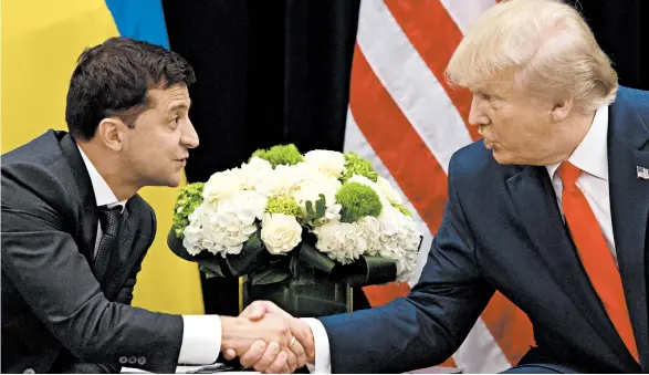  ?? SAUL LOEB/GETTY-AFP ?? Ukraine’s Volodymyr Zelenskiy and President Trump meet Wednesday on the sidelines of the U.N. General Assembly.