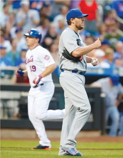  ?? | GETTY IMAGES ?? The Mets’ Jay Bruce circles the bases behind Cubs starter John Lackey after hitting a two- run homer in the third inning.