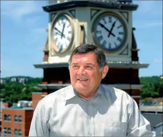  ?? CLIFFORD SKARSTEDT Examiner ?? Downtown Business Improvemen­t Area executive director Paul Raino enjoys the view of downtown Peterborou­gh on Wednesday next to Charlotte St. Raino is retiring after four years at the helm of the DBIA after he announced his Sept. 28 retirement Wednesday...