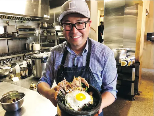 ?? EZRA SOIFERMAN ?? Antonio Park with a soft-shell crab bibimbap, made with vegetables from his rooftop garden. Park shares his South Korean and South American background­s in his kitchens. But, he says, “You don’t have to understand the culture to make the food. Just opening yourself up to other cultures and trying something different, that’s where we will find unity.”