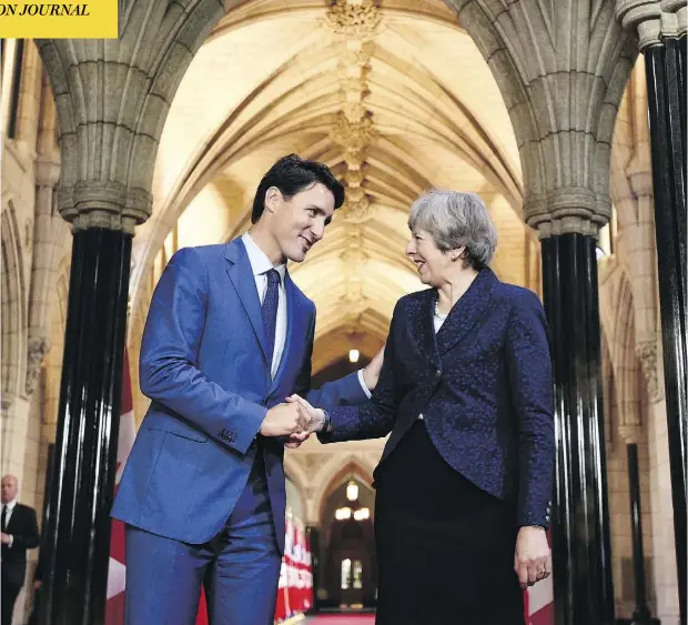  ?? JUSTIN TANG / THE CANADIAN PRESS ?? Prime Minister Justin Trudeau shakes hands with British Prime Minister Theresa May during her visit to Parliament Hill on Monday.