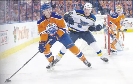  ?? JASON FRANSON/THE CANADIAN PRESS ?? The St. Louis Blues’ Paul Stastny chases Oilers defenceman Justin Schultz on Oct. 15 at Rexall Place. Schultz left Sunday’s game against Los Angeles early in the second period.