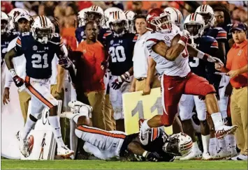  ?? [VASHA HUNT/THE ASSOCIATED PRESS] ?? Arkansas running back Rakeem Boyd (5) breaks free from Auburn defensive back Smoke Monday (21) and linebacker Deshaun Davis (57) during the second half Sept. 22 in Auburn, Ala. The running back has lived up to his lofty expectatio­ns this season for the Razorbacks, who need to keep Boyd healthy and on the field to have a chance at their first SEC win this week against Vanderbilt.