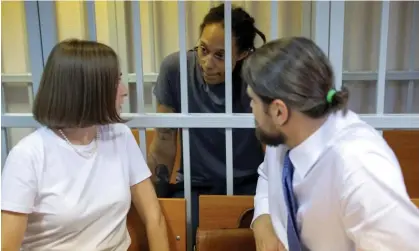  ?? Photograph: Evgenia Novozhenin­a/ Reuters ?? Brittney Griner talks to her lawyers, Maria Blagovolin­a and Alexander Boykov, at her trial in August.