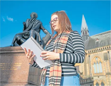  ??  ?? Jena Jamieson reads one of her poems beside the statue of Robert Burns in city centre. Picture by Kim Cessford.