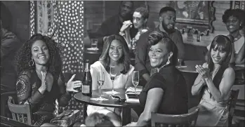  ?? MICHELE K. SHORT/UNIVERSAL PICTURES ?? Tiffany Haddish, from left, Regina Hall, Queen Latifah and Jada Pinkett Smith star as four reunited friends in “Girls Trip.”