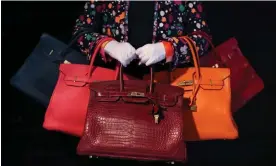  ?? Hermès. Photograph: Yui Mok/PA ?? According to handbag lore, purchasing a Birkin bag means proving your worth to