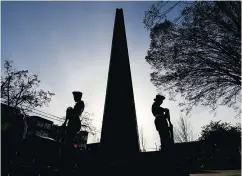  ??  ?? Remembranc­e Day ceremonies take place at the Grandview Park cenotaph on Commercial Drive.