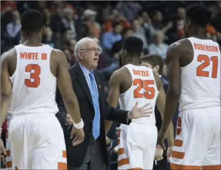  ?? MARY ALTAFFER — THE ASSOCIATED PRESS ?? Syracuse head coach Jim Boeheim, second from left, gestures during a game against the Miami in the ACC tournament. The Orange will face UNC Greensboro in the first round of the NIT.