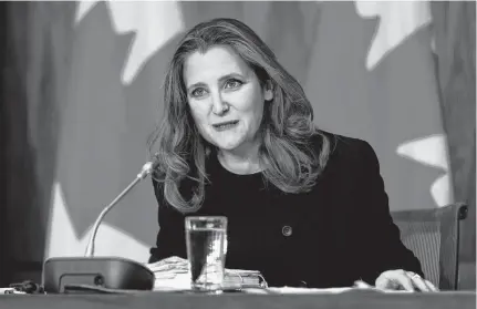  ?? BLAIR GABLE • REUTERS ?? Deputy Prime Minister and Minister of Finance Chrystia Freeland speaks to media before unveiling her first fiscal update, the Fall Economic Statement 2020, in Ottawa on Monday.