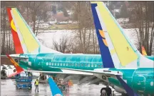  ?? Jason Redmond / AFP/ Getty Images ?? In this file photo taken on March 12, Boeing 737 Max planes are pictured at the Boeing Renton Factory in Renton, Wash.