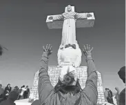  ?? LUIS TORRES FOR THE EL PASO TIMES ?? Catholics and other Christians make a pilgrimage to the summit of Mount Cristo Rey to pray in observance of Good Friday, Friday, April 7, 2023.