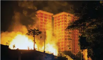  ?? — AFP photos ?? Photo released by Guaido’s photograph­y service showing an explosion at a state owned electricty company Corpoelec power substation in Caracas, where several explosions of unknown cause took place early on March 11 as a massive power outage continues affecting some areas of the country.