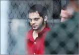  ?? Associated Press photo ?? Esteban Santiago is taken from the Broward County main jail as he is transporte­d to the federal courthouse in Fort Lauderdale, Fla., on Monday. Santiago is accused of fatally shooting several people at a crowded Florida airport baggage claim and faces...