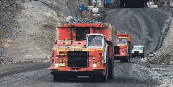  ??  ?? A truck carries ore from the undergroun­d Nova mine.