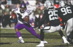  ??  ?? VIKING WEATHER: Minnesota Vikings running back Adrian Peterson (28) carries against the Oakland Raiders during the first half last week in Oakland, Calif. Peterson’s 961 yards rushing easily lead the league. And the Vikings have a defense ranked ninth...