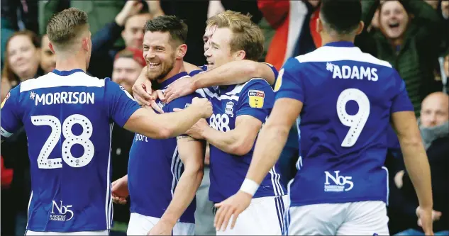  ?? PICTURE: PA Images ?? HAT-TRICK MAN: Birmingham City’s Lukas Jutkiewicz, second left, is mobbed after scoring their first goal