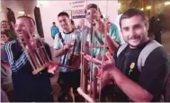  ?? ?? The performanc­es engaged football fans to try playing the angklung.