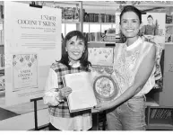  ?? ?? TALKING favorite RECIPES Australian-filipino food and travel writer Yasmin Newman shares her favorite recipes with SM’S Millie Dizon at the Book Nook of SM Aura Premier.