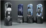  ?? ?? A bespoke champagne case is sculptured to look like the brand’s high-end models.