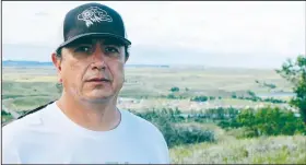  ?? AP/JAMES MACPHERSON ?? Standing Rock Sioux Chairman Dave Archambaul­t II poses for a photo Aug. 26 near Cannon Ball., N.D., on the Standing Rock Sioux Reservatio­n overlookin­g an encampment where Native Americans from across North America have gathered to join his tribe’s...