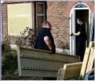  ??  ?? DEFENCES: Workmen fit security grilles to the Osborn-Brookses’ home. A surveillan­ce camera has also been set up nearby