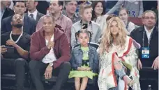  ?? — AFP ?? Beyoncé Knowles and Jay Z, pictured with their daughter, were a part of an all-star line-up at a concert in Johannesbu­rg to honour the life and legacy of Nelson Mandela.