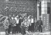  ??  ?? Clockwise from top left: Sudanese acrobats look at publicity boards at the Beijing Tianqiao Arts Performing Center; Sudanese acrobats come back to Wuhan and meet their acrobatic instructor­s; Nine acrobats from Sudan National Acrobatic Troupe with their...