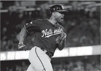  ?? MARCIO JOSE SANCHEZ/AP PHOTO ?? Howie Kendrick of the Washington Nationals celebrates after a grand slam against the Los Angeles Dodgers during the 10th inning in Game 5 of the NLDS on Wednesday night in Los Angeles.