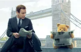  ??  ?? A grown-up Christophe­r Robin (Ewan McGregor) with Pooh Bear