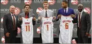  ?? JOHN BAZEMORE / AP ?? 2018 first-round draft picks Trae Young, Kevin Huerter and Omari Spellman pose with general manager Travis Schlenk (left) and coach Lloyd Pierce.