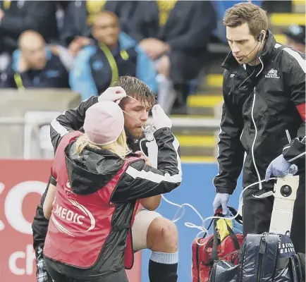  ??  ?? 2 Ryan Wilson receives attention on the pitch after sustaining a head injury during Glasgow Warriors’ match against Leinster last Saturday.