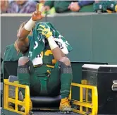  ?? PATRICK MCDERMOTT/GETTY IMAGES ?? Packers running back Aaron Jones gets carted off the field after being injured in the second quarter against the Chargers.