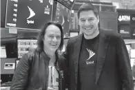  ?? AP Photo/Richard Drew ?? ■ T-Mobile CEO John Legere, left, and Sprint CEO Marcelo Claure pose for photos Monday on the floor of the New York Stock Exchange.