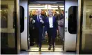  ?? Station. Photograph: Kirsty O’Connor/PA ?? Andy Byford, commission­er at Transport for London, and the London mayor, Sadiq Khan, disembark the first Elizabeth line train to carry passengers at Farringdon