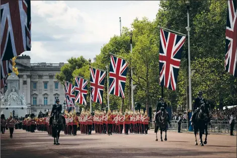  ?? (File Photo/AP/Felipe Dana) ?? Guards escort the coffin of Queen Elizabeth II on Wednesday during a procession from Buckingham Palace to Westminste­r Hall in London. Stories circulatin­g online incorrectl­y claim all funeral services in the U.K. have been canceled on Monday, the day Queen Elizabeth II is set to be buried.