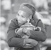  ?? Mike Groll / Houston Chronicle ?? Serena Williams last hugged the U.S. Open championsh­ip trophy in 2014. She begins her quest for a 23rd Grand Slam singles title on Monday.