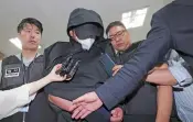  ?? AP ?? The man who opened an emergency exit door during a flight, arrives to attend an arrest warrant review at the Daegu District Court in Daegu, South Korea, on Sunday.